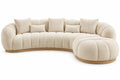 Canapé beige courbé à assise segmentée et avancée arrondie