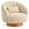 Fauteuil beige arrondi à dossier segmenté et socle cylindrique